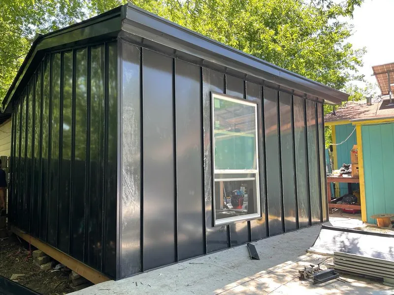 Black standing seam metal wall panels for Roof Inspection in Hobart